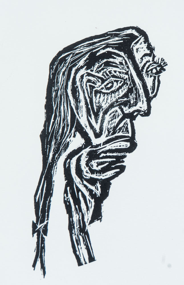 Grabado "Meiga caldeiro" de Laban (Jorge Labandeira): cabeza de bruja de perfil, con nariz ganchuda, ojo abierto y capucha, dibujada en negro a línea sobre papel blanco.