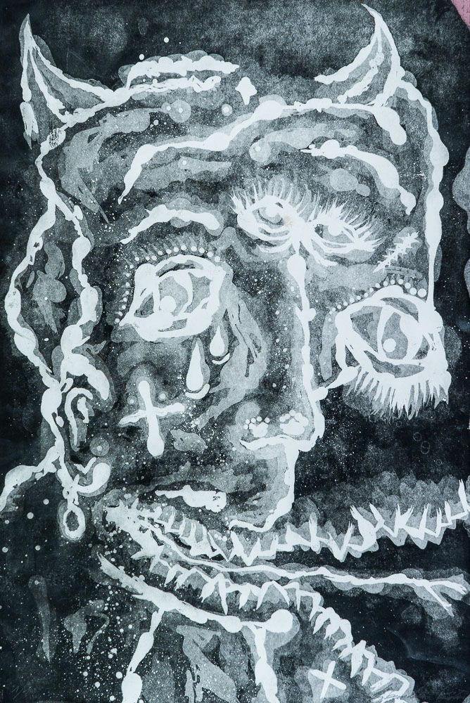 Grabado "Demonio, el origen" de Laban (Jorge Labandeira): cara de demonio con cuernos, lágrimas y boca de dientes, dibujada en blanco sobre fondo negro con texturas de aguatinta.